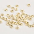 Nahaufnahme von 14k vergoldeten Doppel-Loch-Schmuckverbindern für DIY-Armbänder und Ketten - 14K Gold Doppeloch Ring (5mm)