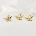 Macro detail of three 14k gold plated bird pendants with sparkling cubic zirconia accents - 14k Gold Bird / Gold
