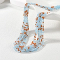 Detail of layered faceted beads in blue and orange for DIY jewelry making and crafts - Blue and Orange Mix (MH-9)