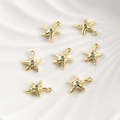 Macro detail of 14k gold plated starfish pendants with blue zircon and sea shell texture - 14K Gold Starfish (12.8*10.5mm)