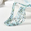 Detailed view of 2mm faceted glass beads in light blue, green and dark grey layers - Blue Green and Gray Mix (MH-7)