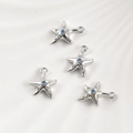 Close-up of four starfish pendants with blue zircons and shiny silver plating - White Gold Starfish (12.8*10.5mm)