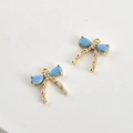 Macro view of blue teardrop zircon bow pendants with 14k gold plating for DIY jewelry - 14K Gold Base Light Blue Turquoise Bow