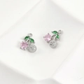 Detailed view of cherry pendant with pink and green zircon in 14k gold plating - White Gold Plated Pink Zirconia Cherry / Pink