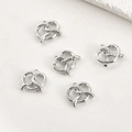 Detailed view of five silver pretzel heart pendants for DIY jewelry making and crafts - White Gold Smooth Heart Style / Silver