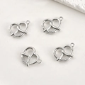 Close-up of four 14k gold-plated heart charms with micro-pave zircon stone details - White Gold 3-Zircon Slanted Heart Style / Silver