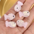 Macro shot of 5 pink translucent fish-shaped resin beads with sparkling gold foil - Pink Foil Fish (2#)