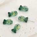 Macro detail of fish-shaped green glass beads with gold foil for DIY jewelry making - Peacock Green Foil Fish (5#)