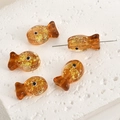 Macro detail of amber fish-shaped glass beads with gold foil for DIY jewelry - Caramel Foil Fish (7#)