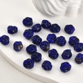Macro view of blue glass rose beads for handmade jewelry making and DIY crafts - Sapphire Blue