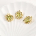 Macro shot of 14k gold plated olive green zircon pendants on white shell tray - 14k Gold Plated Olive Green Zircon Oval (Approx 19.7x16mm)