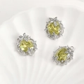 Macro detail of 14k gold plated oval olive green zircon leaf pendants for jewelry making - White K Silver Plated Olive Green Zircon Oval (Approx 19.7x16mm)