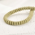 Macro detail of 4x8mm olive green lava stone rondelle beads for DIY jewelry making - 4*8mm / Mustard Green