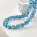 Blaue Stern-Glasperlen mit gelben und grünen Details für handgefertigten DIY-Schmuck - 5 Stück / Seeblau Stern