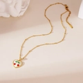 Close-up of gold cherry heart pendant necklace with red details and beaded chain link - Heart Cherry Necklace Style H (25WN034)
