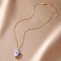 Detail of heart porcelain pendant with blue floral pattern on gold plated chain - Heart Style