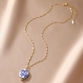 Detail of 18K gold-plated necklace with blue tulip ceramic pendant on champagne satin - Flat Round Double Flower Style