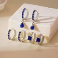 Three pairs of elegant copper earrings set with blue square zircon stones in silver tone - 3 Pairs Set / Silver Blue