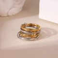 Detailed view of interlinked mixed-texture gold and silver rings with five stacked bands - Size 6 / Gold and Silver Interlinked Style (Style C)