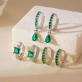 Three pairs of silver earrings with green square zircon stones on marble display - 3 Pairs Set / Silver Green