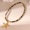 Detail of 18K gold starfish pendant with leopard print velvet cord and extender chain - Starfish