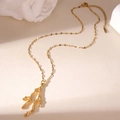 Detailed macro view of 18K gold plated coral pendant with adjustable link chain - Coral