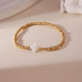 18K gold plated copper beaded bracelet with a white star-shaped shell pendant - Gold Star
