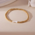 18K gold plated bead bracelet featuring a minimalist white bone charm for women - Gold Bone