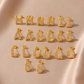 Elegant gold letter earrings set with sparkling cubic zirconia on champagne silk backdrop - Letter A / Gold