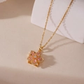 Macro detail of golden flower necklace with pink zircon petals and pavé crystals - Pink