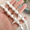 Macro view of irregular Baroque imitation pearl beads for DIY jewelry making - 13x9mm