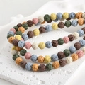 Macro shot of 4-8mm porous multi-colored lava stone round beads for DIY jewelry making - Multicolor 8mm (approx. 8-8.5mm)