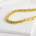 Macro detail of 4mm gold plated lava stone wheel beads with unique hammered texture - Style 4 Imitation Gold Disc 7mm (Approx 6.7x2.3mm Hole 1mm)