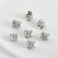 Macro shot of 7 silver floral spacer beads with sparkling zircon stones for jewelry DIY - 10# White Gold Plated Flower Barrel Bead with Bail
