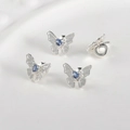 Close-up of four silver butterfly charms with blue heart zircon for DIY jewelry making - Thick Silver Sea Blue Bowknot (Approx 14*17.3mm)