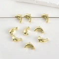 Macro view of 14k gold-plated dolphin-shaped spacer beads for DIY jewelry making - Dolphin / 14K Gold