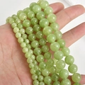 Detailed view of 8mm natural Persian jade round beads in pale green for DIY jewelry making - Grape Green 6mm (Approx. 58 Beads)