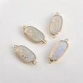 Set of four oval gold-rimmed connectors with white opal finish and star patterns - Opal Star (11#)