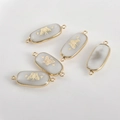 Detail of oval natural stone jewelry connectors with gold butterfly and star patterns - White Agate Butterfly (10#)