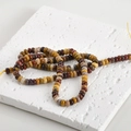 Close-up of multicolored natural stone abacus beads on textured white background for DIY - 8# Abacus Bead Style / 2x4mm (160 Pieces/Pack) / Yellow Jasper