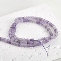 Close-up of translucent purple jade abacus beads on a textured white display board - 17# Abacus Bead Style / 2x4mm (160 Pieces/Pack) / Purple Crystal