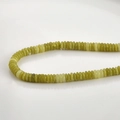 Macro shot of 2x6mm natural yellow-green jade abacus beads with smooth oily texture - 23# Abacus Bead Style / 2x6mm (160 Pieces/Pack) / Korean Jade