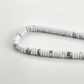 Detailed macro view of white Howlite heishi beads with natural grey marble textures - 30# Abacus Bead Style / 2x6mm (160 Pieces/Pack) / Howlite