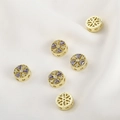 Macro shot of 14k gold-plated round beads with purple cubic zirconia and hollow geometry - Purple Zirconia Round Style (17#)