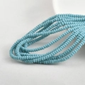 Macro shot of 2x4mm sky blue glass spacer beads for DIY jewelry making and crafts - Pine Blue