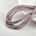 Detailed macro shot of 2x4mm lavender glass spacer beads for DIY jewelry making - Taro Porcelain