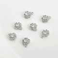 Macro shot of silver clover pendants with zircon stones and integrated hanging loops - White Zirconia Four-Leaf Clover (9.3*7.5mm) / Silver
