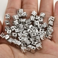 Macro shot of silver plated cube beads with unique pitted texture for DIY jewelry making - White K Gold Color (Approx 5.1*4.7mm)