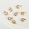 Detailed view of eight 14k gold plated teardrop charms with sparkling cubic zirconia crystals - White Zirconia Water Drop (10*6.5mm) / Gold