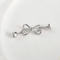 Dettaglio del fermaglio a fiocco in argento per la creazione di collane e bracciali fai-da-te - Doppia Fibbia a Fiocco (circa 45*15mm) / Oro bianco